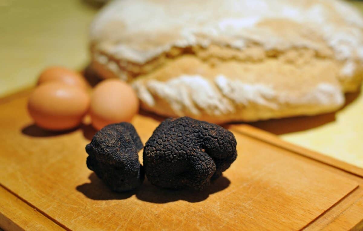 black truffles on a chopping board