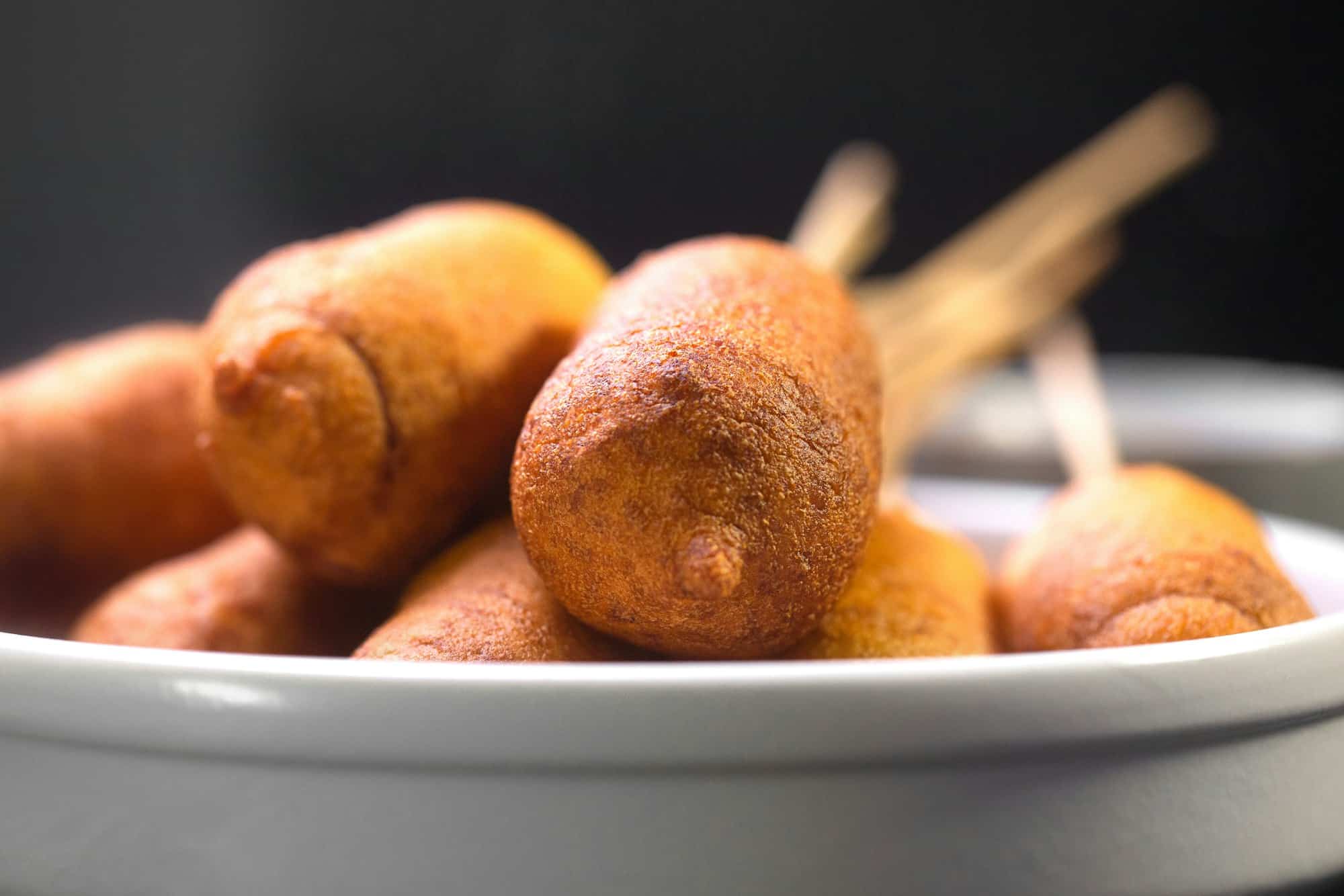 Corn dogs cooked with sausage and dough